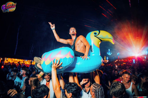 Jungle Experience Party Koh Phangan – partygoer crowd-surfing on an inflatable toucan