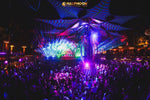 Halfmoon Party Koh Phangan – stage under a blue palm-leaf canopy with the crowd