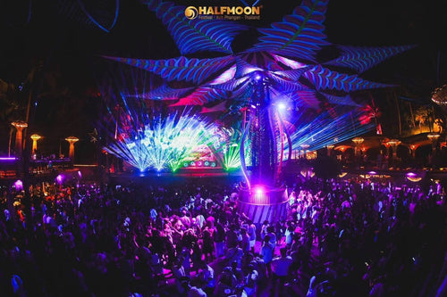 Halfmoon Party Koh Phangan – stage under a blue palm-leaf canopy with the crowd