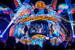 Jungle Experience Party Koh Phangan – colourful creature-head DJ booth lit with lasers at night
