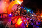 Jungle Experience Party Koh Phangan – performer swirling orange fabric above the crowd