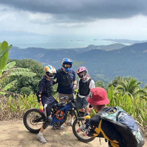 Electric Dirt Bike Tour 3 Hours Koh Samui – riders with electric dirt bikes in a jungle clearing – TourInKohSamui.com