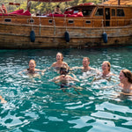 Private All-Day Sailing Charter Koh Samui – guests snorkelling off the boat near Koh Taen – TourInKohSamui.com